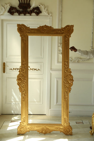 Frame of oversized proportions and rococo elements inspired by Louis XV
