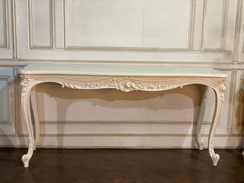 Louis XV console with intense carving and sleek silhouette