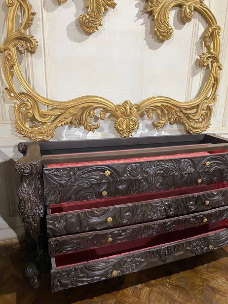 Surreal bombé commode with dramatic rococo scrolls