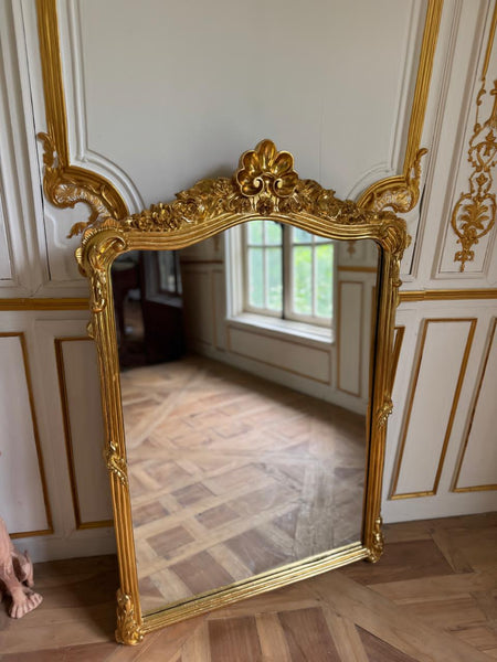 Louis XVI frame with floral cartouche~