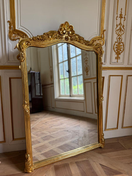 Louis XVI frame with floral cartouche~