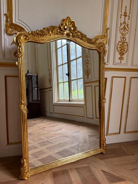 Louis XVI frame with floral cartouche~