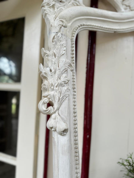 Rococo-style frame with scrolls~