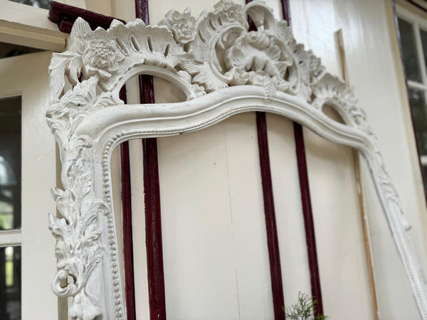 Rococo-style frame with scrolls~