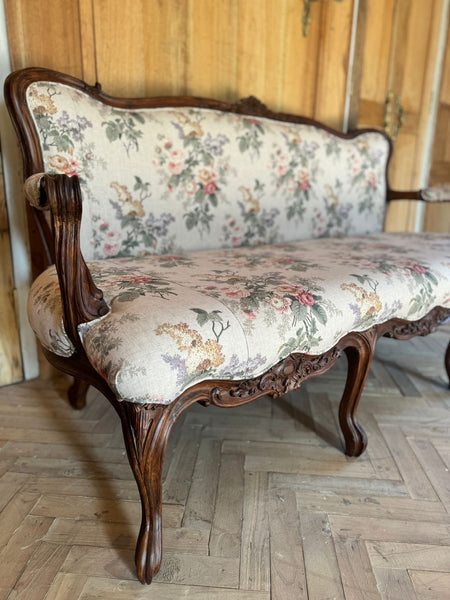 Louis XV settee with naturalistic motifs ~
