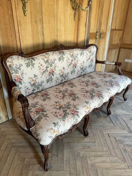 Louis XV settee with naturalistic motifs ~