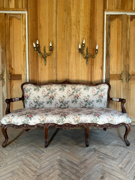 Louis XV settee with naturalistic motifs ~