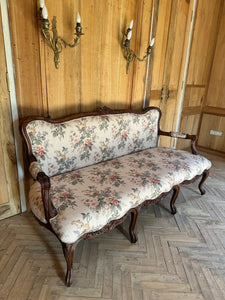 Louis XV settee with naturalistic motifs ~
