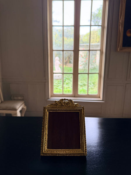 Louis XVI petite frame with scrolled cartouche~