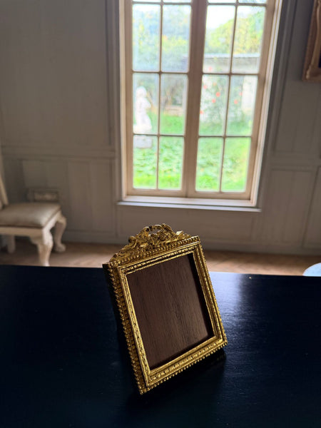 Louis XVI petite frame with scrolled cartouche~