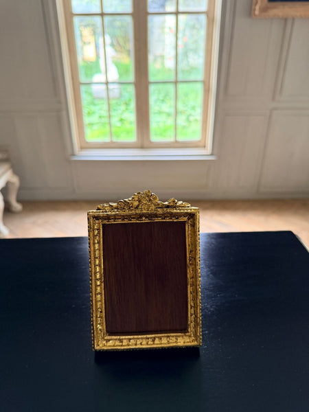 Louis XVI petite frame with floral cartouche~