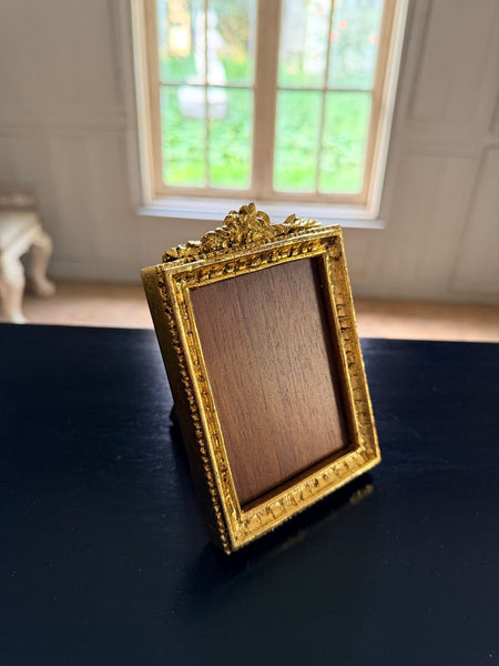 Louis XVI petite frame with floral cartouche~