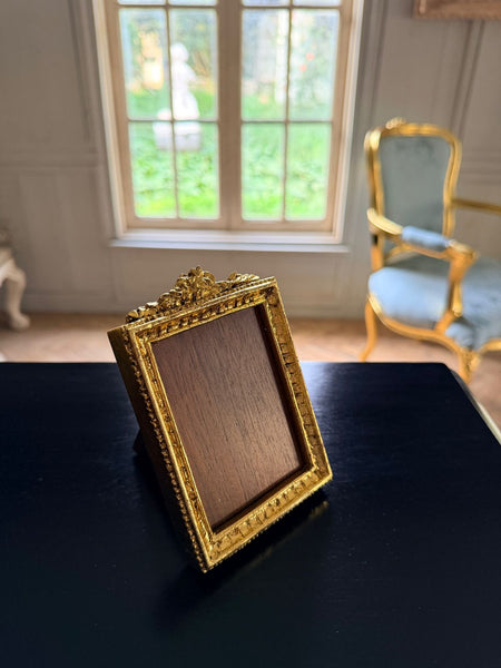 Louis XVI petite frame with floral cartouche~