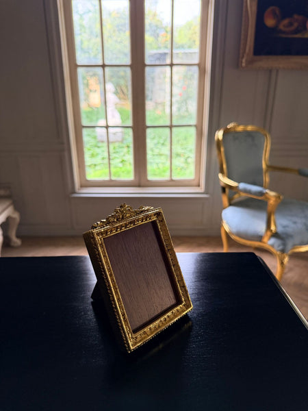 Louis XVI petite frame with floral cartouche~