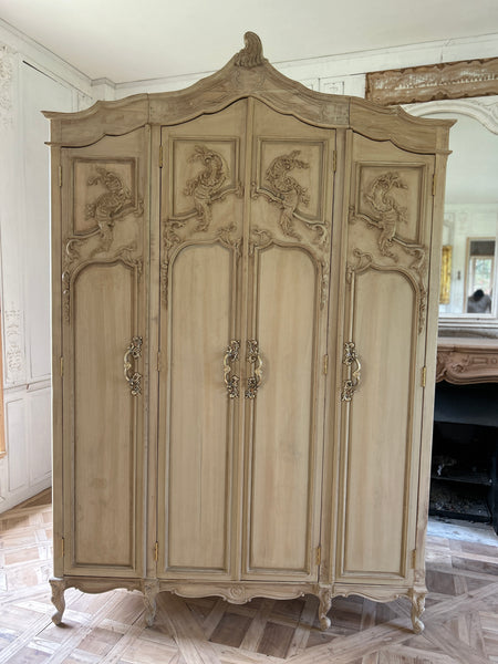 Country style Louis XV armoire with intense carving