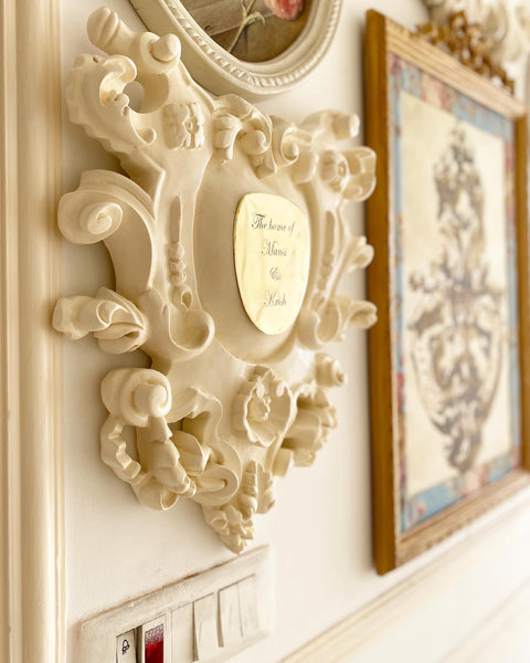 Cartouche nameplate based on rococo ornamentations