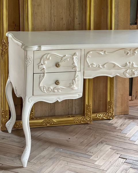 Rococo desk / dresser with exuberant scrolls
