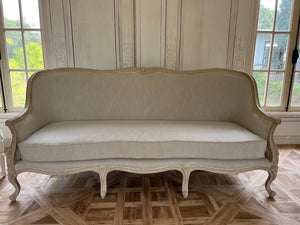 Louis XV bergère sofa of simple elegance