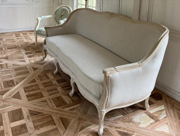 Louis XV bergère sofa of simple elegance