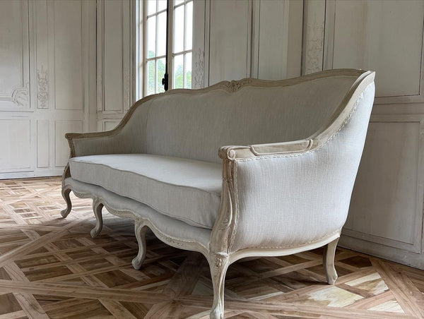 Louis XV bergère sofa of simple elegance