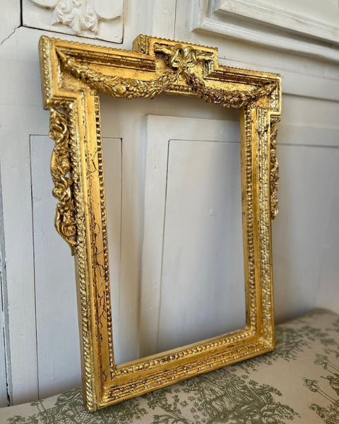 Late neoclassical frame with wreath and bow