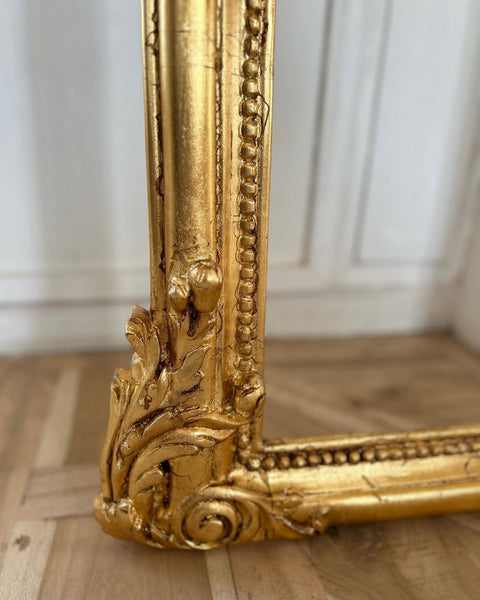 Rococo-style frame with scrolls