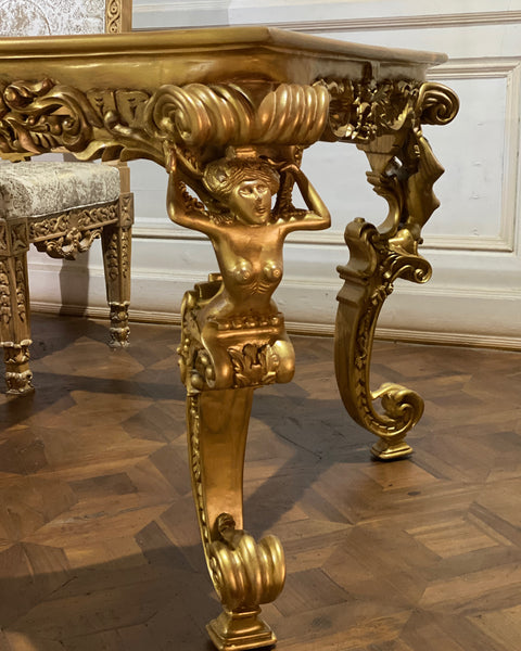 Dining table inspired by Louis XIV antiquity with caryatids.