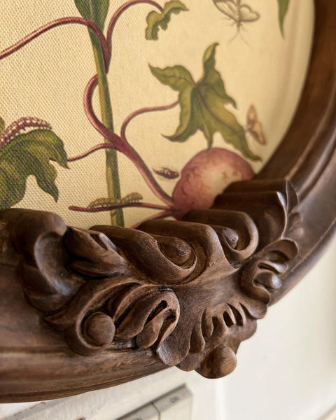 Circular frame with foliage cartouche