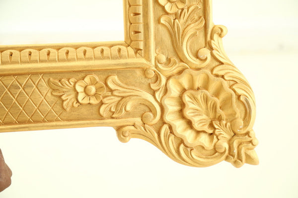 Frame of oversized proportions and rococo elements inspired by Louis XV