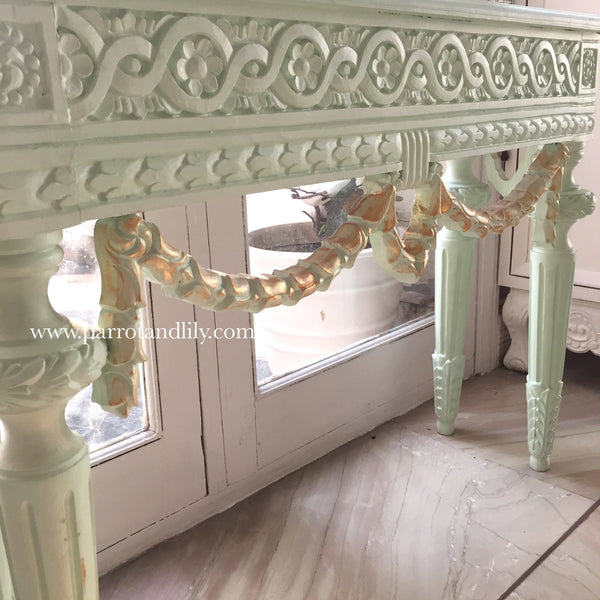 Console table inspired by classic Louis XVI with wreaths