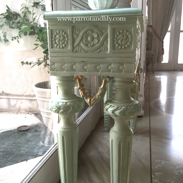 Console table inspired by classic Louis XVI with wreaths