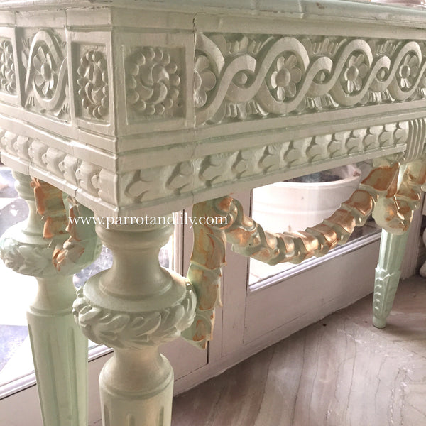 Console table inspired by classic Louis XVI with wreaths
