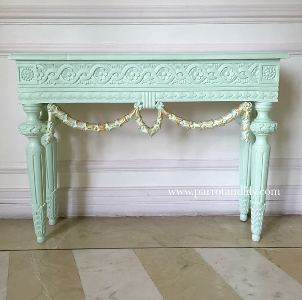 Console table inspired by classic Louis XVI with wreaths