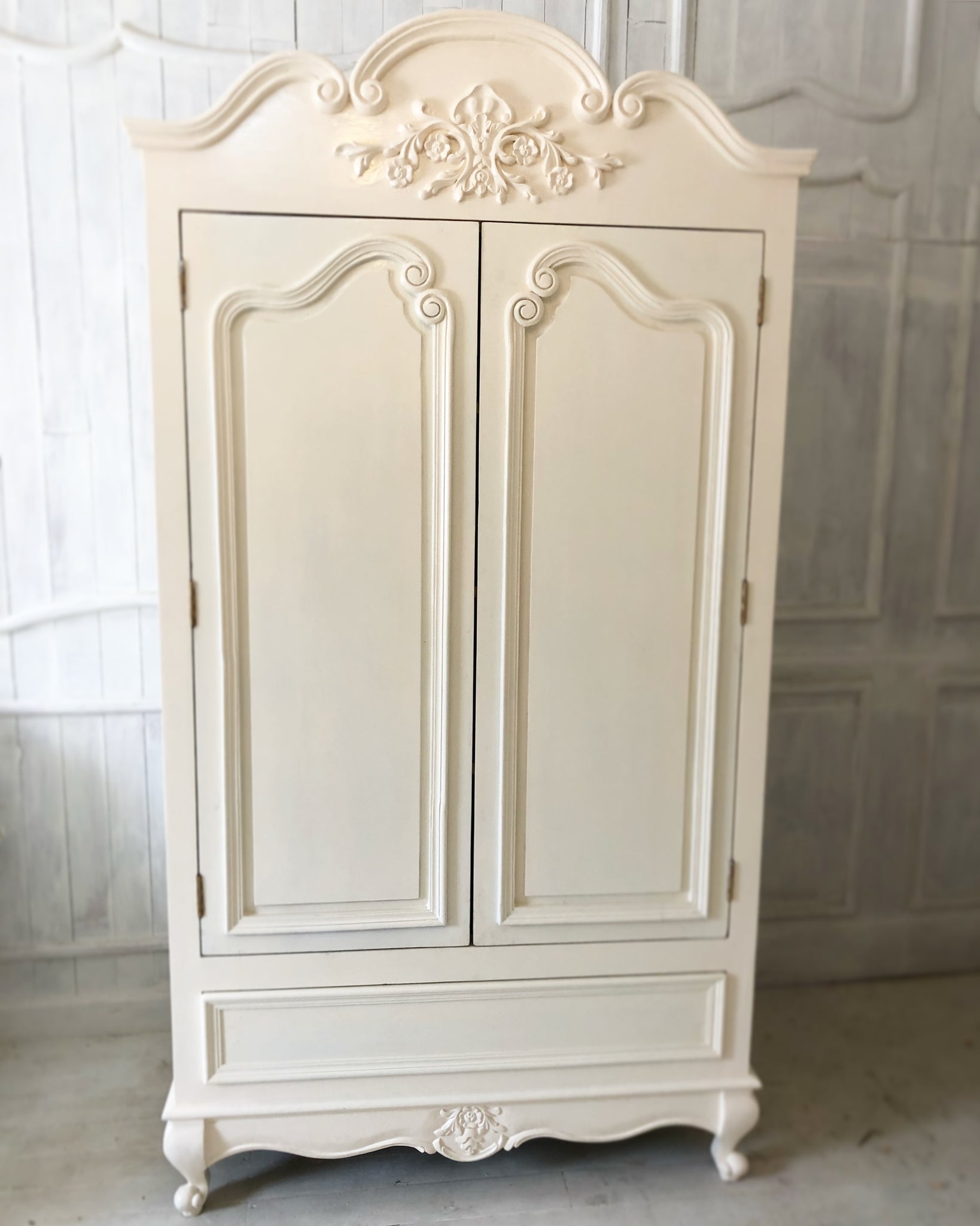 Armoire with a drawer and beautiful ornamentation