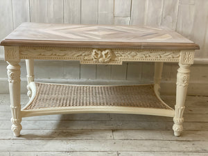 Petite Louis XVI table with wicker shelf with The Unfurling