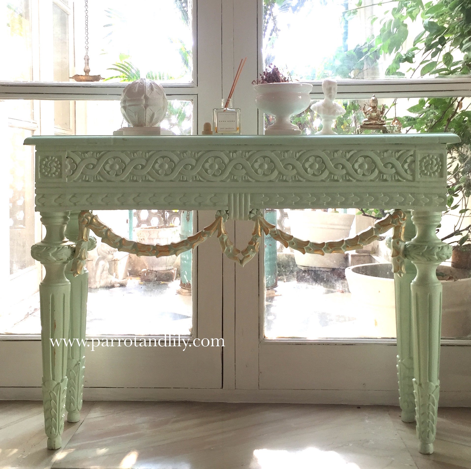 Console table inspired by classic Louis XVI with wreaths
