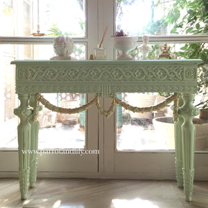 Console table inspired by classic Louis XVI with wreaths