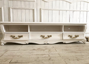 Console for media storage inspired by Louis XV