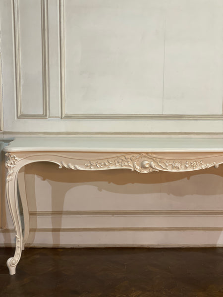 Louis XV console with intense carving and sleek silhouette