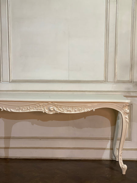 Louis XV console with intense carving and sleek silhouette