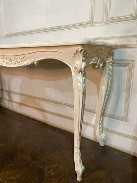 Louis XV console with intense carving and sleek silhouette