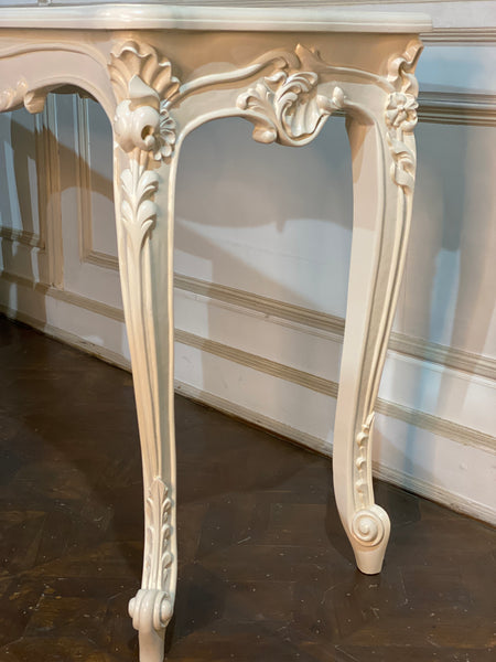 Louis XV console with intense carving and sleek silhouette