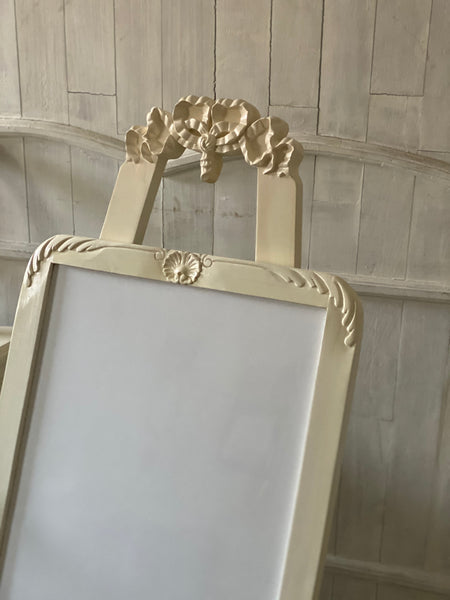 Easel with a ribbon from The Unfurling