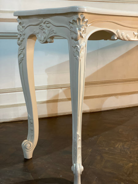 Louis XV console with intense carving and sleek silhouette