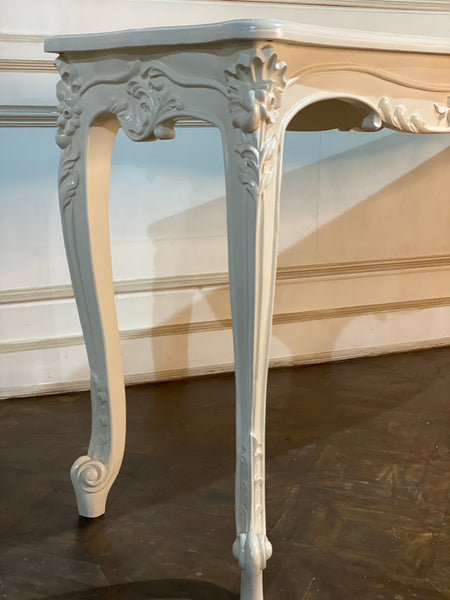 Louis XV console with intense carving and sleek framework