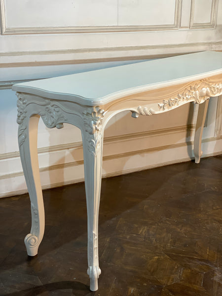 Louis XV console with intense carving and sleek framework