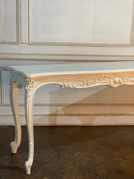 Louis XV console with intense carving and sleek silhouette