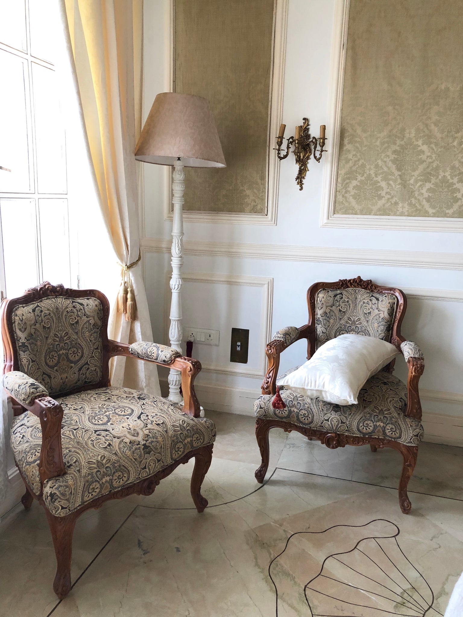 Pair of rococo fauteuils~