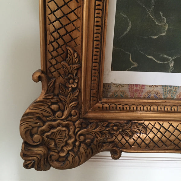 Frame of oversized proportions and rococo elements inspired by Louis XV