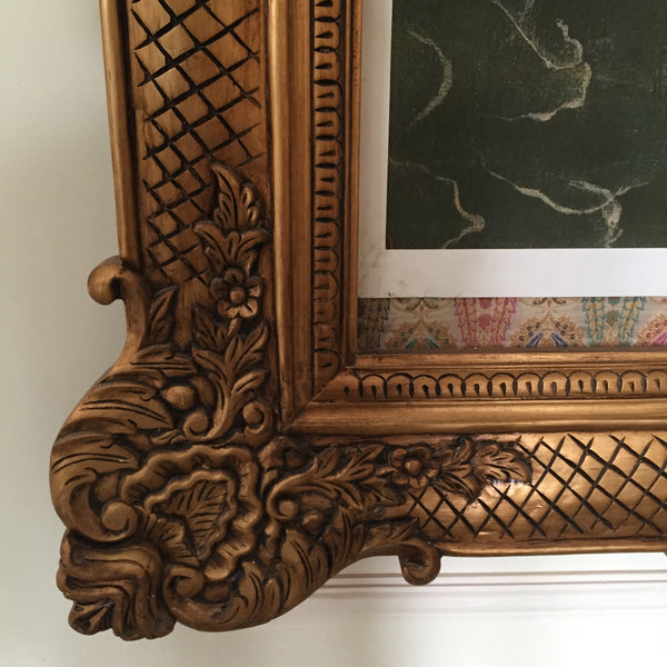 Frame of oversized proportions and rococo elements inspired by Louis XV